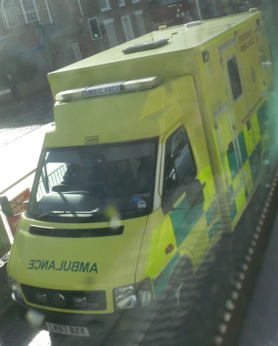 an ambulance is painted in bright yellow and green