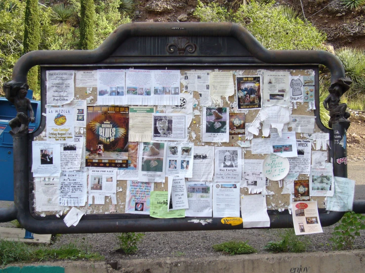 a poster is posted on the side of a wall