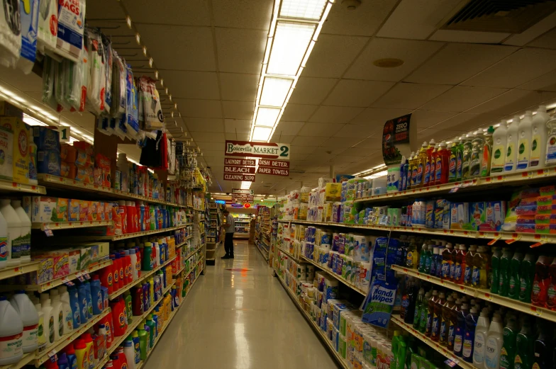 a supermarket aisle filled with lots of bottles