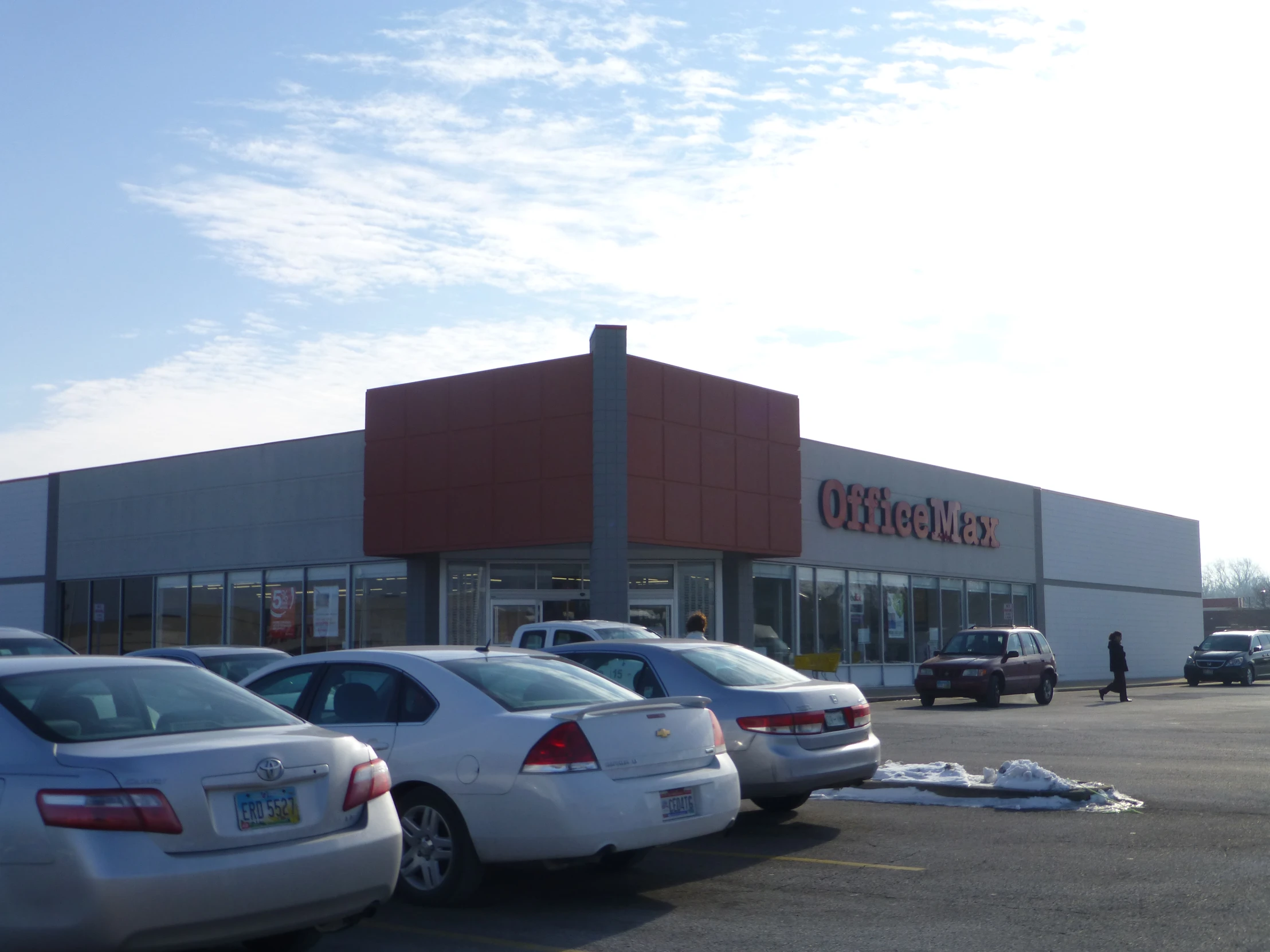 the parking lot outside of a new look shopping center