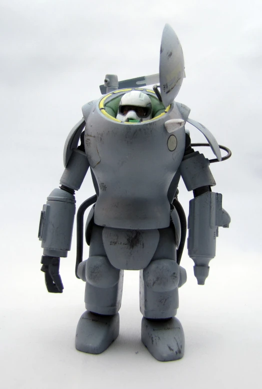 a toy robot made of plastic with a small camera on its head
