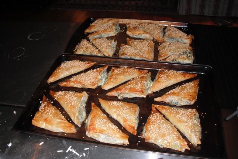 several pastries in pans ready to be served