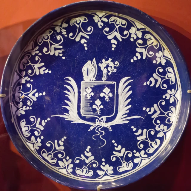 a blue and white plate sitting on top of a table