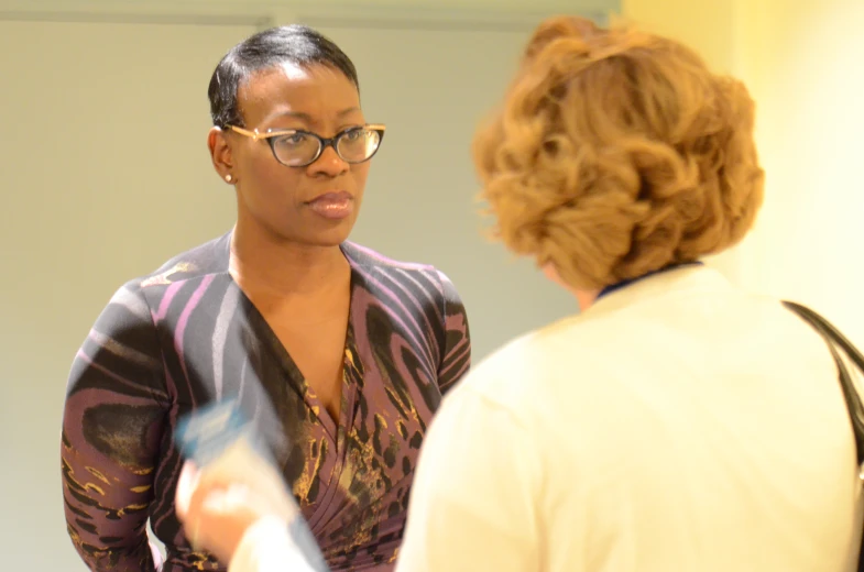 a woman is talking to another person