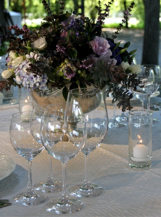 a close up of some wine glasses on a table