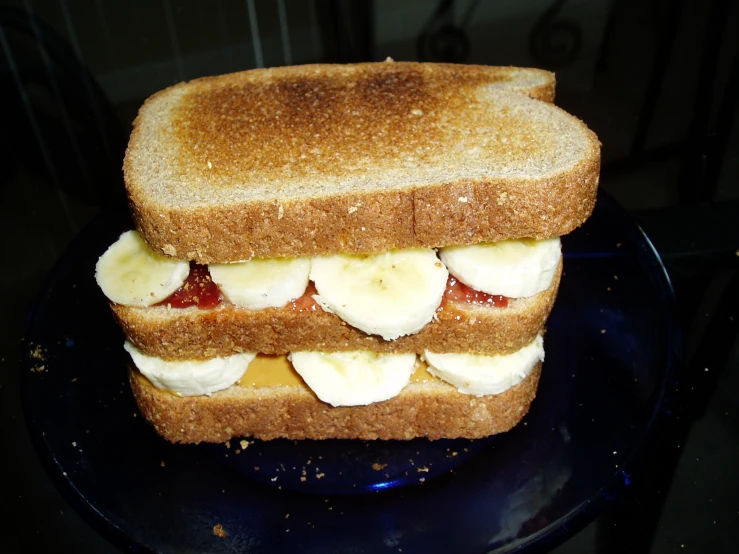 a very tasty looking sandwich with bananas and fruit