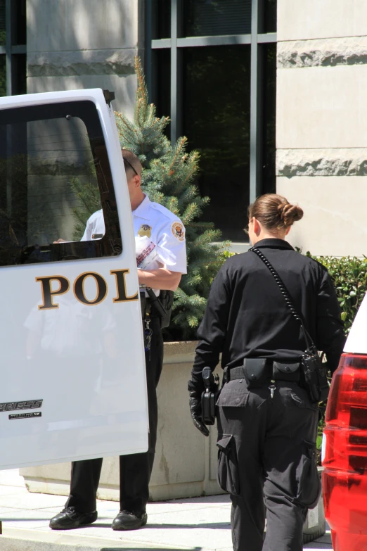 two officers are preparing to board an oncoming car