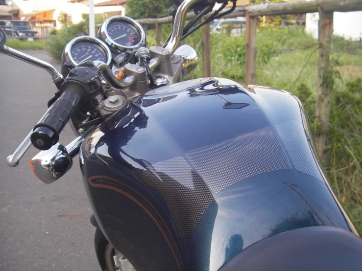 the gauges are visible on a shiny motor cycle