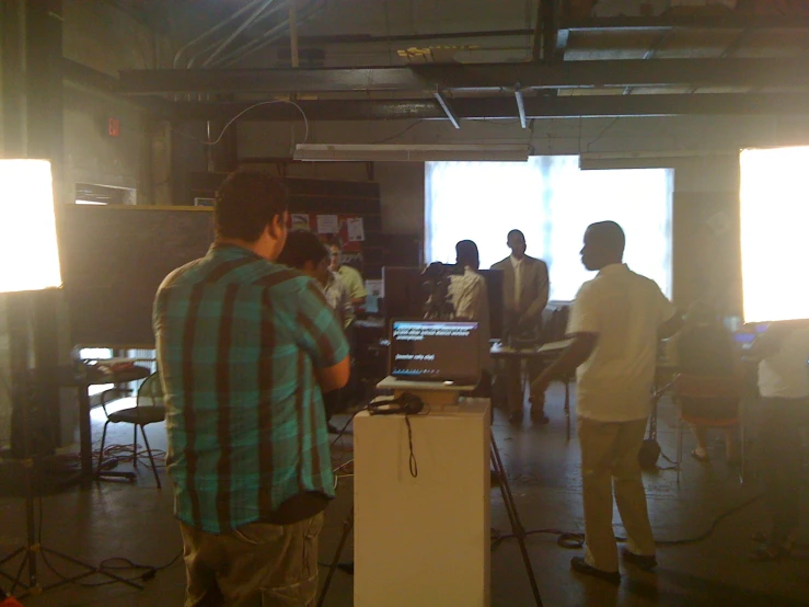 a group of people standing in a room