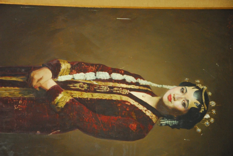 an antique portrait of a woman in a chinese outfit