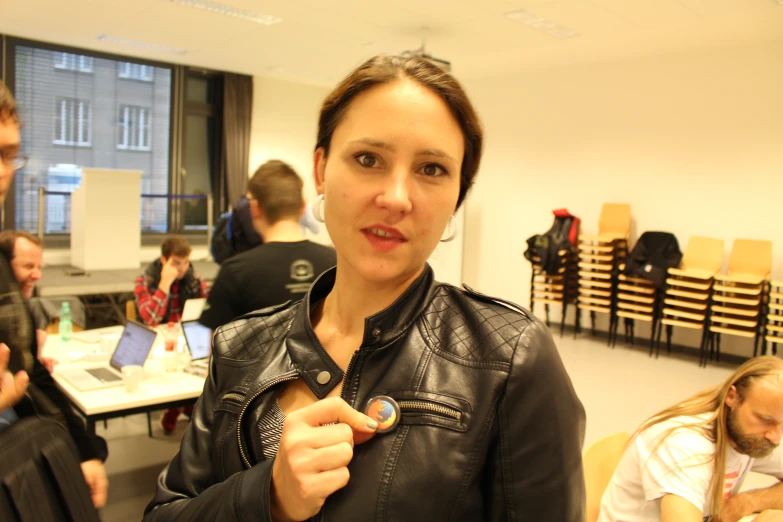 a woman posing with her leather jacket on