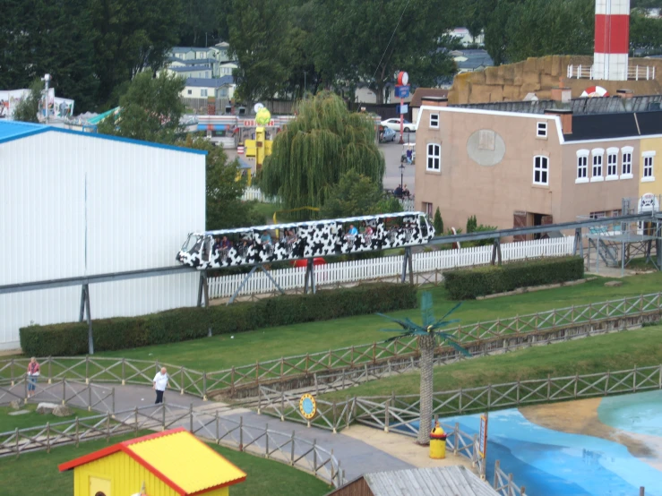 a toy train that is painted with cows