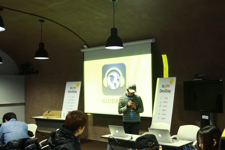 man giving a presentation in a conference room