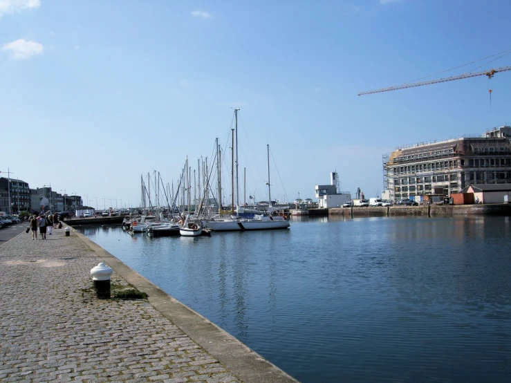 many boats are lined up on the water