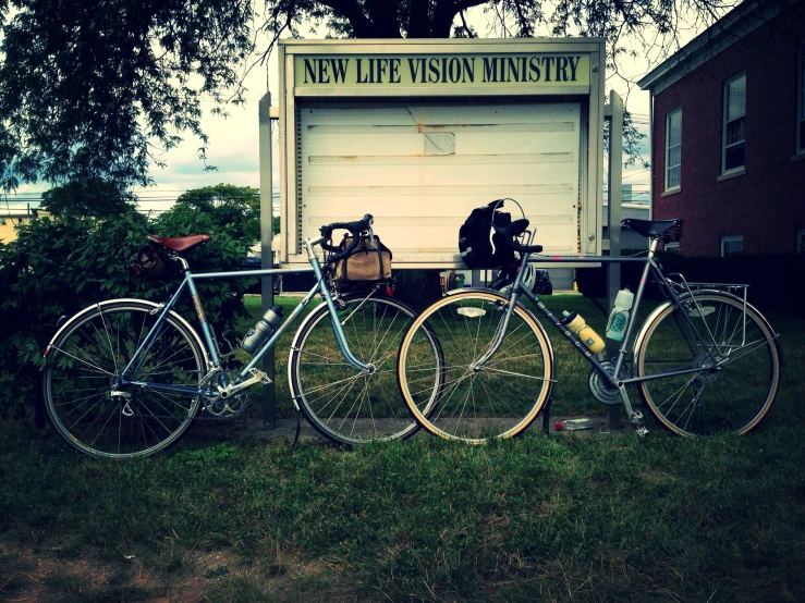 some bikes are parked next to the garage