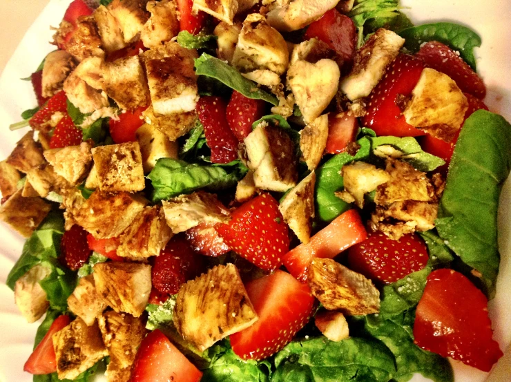 a salad that includes sliced bananas and strawberries