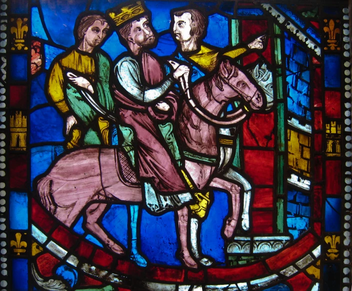 an old stained glass picture of three men on horseback