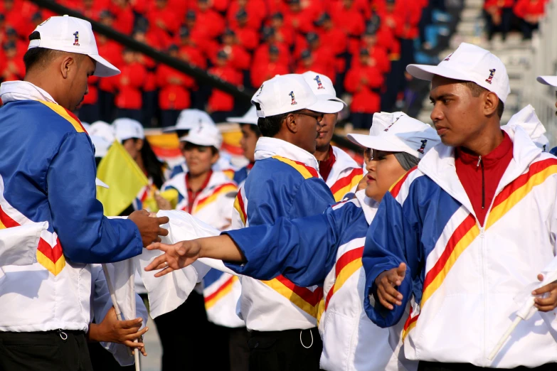 a large group of men stand near each other