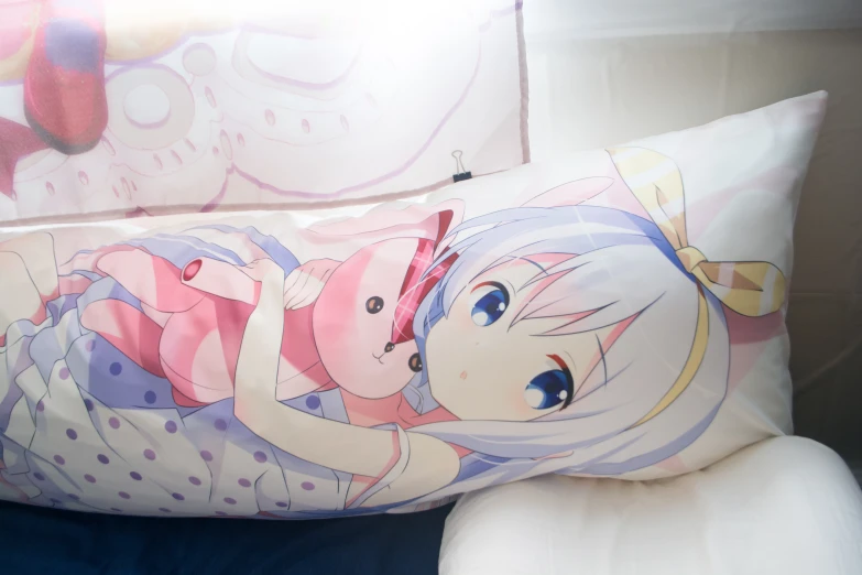 an anime pillow case with a drawing of an angel girl on it
