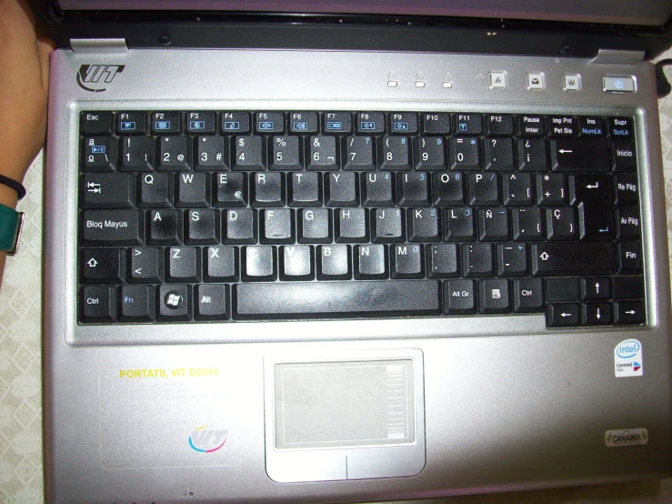 the black and silver keyboard is opened on the laptop
