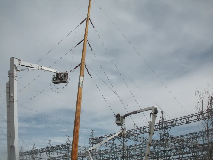 there is an electric wire being raised in the air