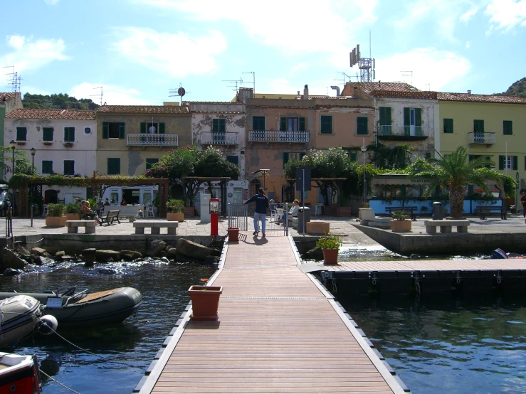 a long dock in front of an italian city