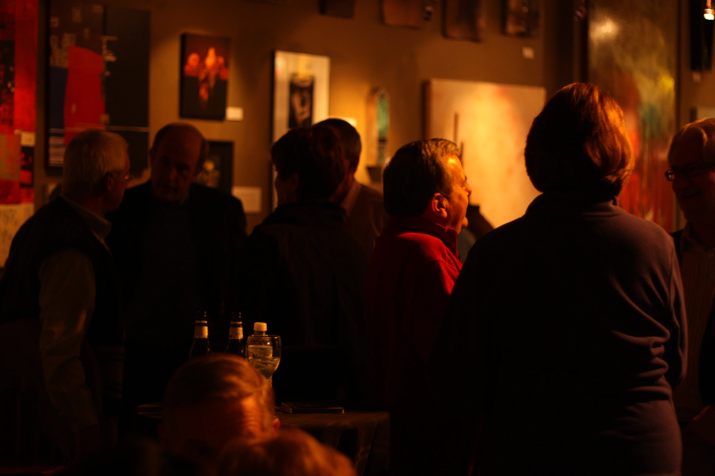 a group of people talking at an event