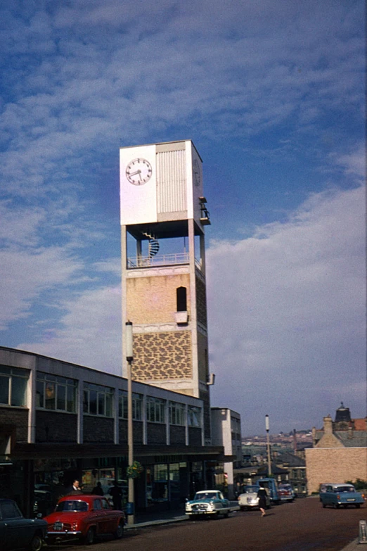 the tall tower has a clock displayed on it