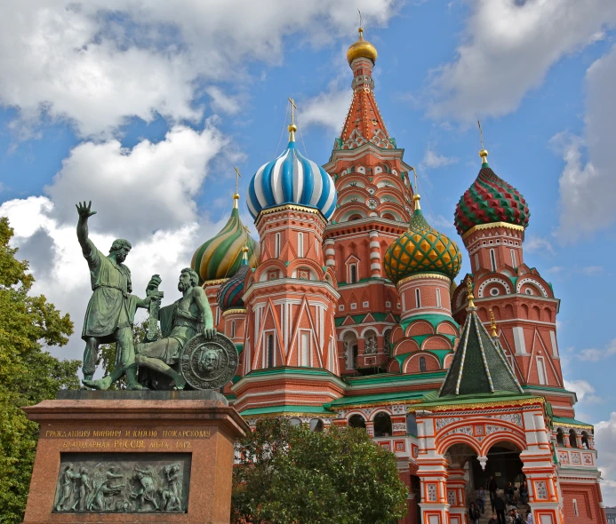 an image of architecture with statues and a blue sky