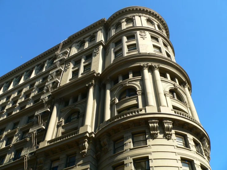 the facade of an old - style building rises in the sky