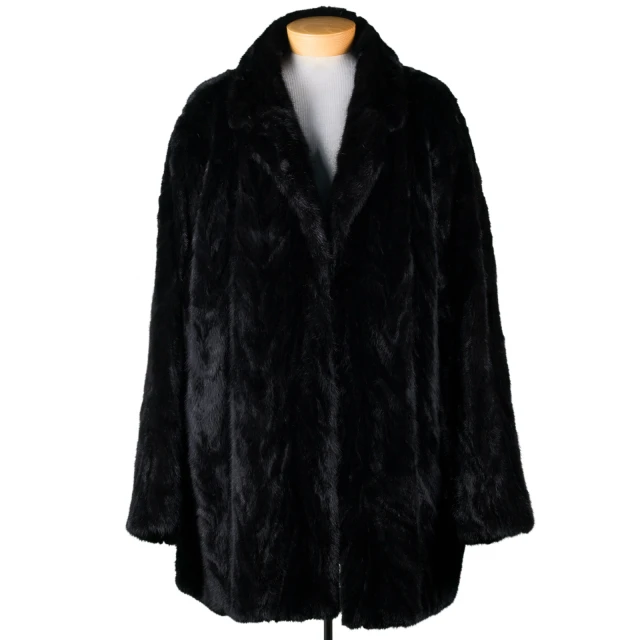 a black fur coat with a white shirt