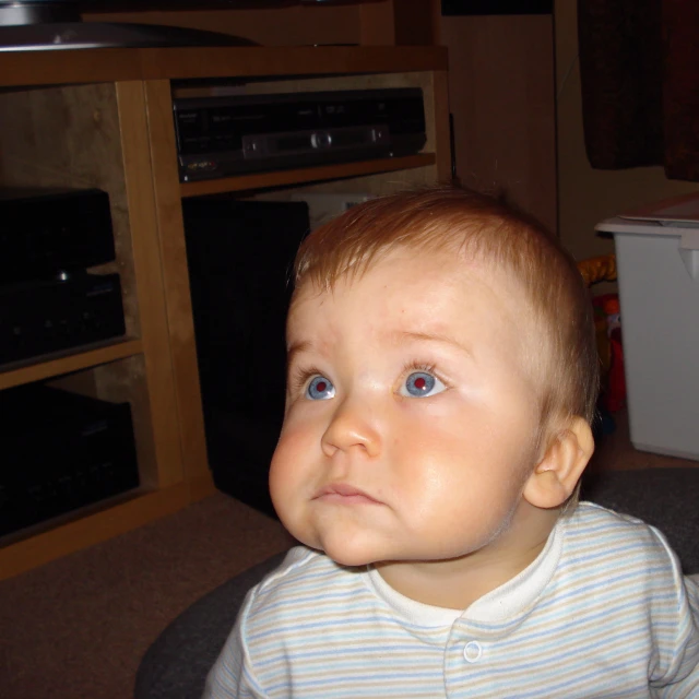 an image of a baby with big blue eyes