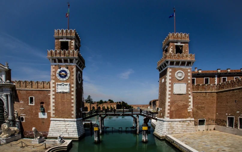 a bridge spanning over some water with two towers above it