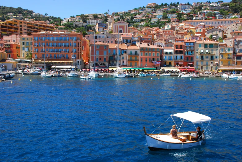 people sitting on a boat in a river