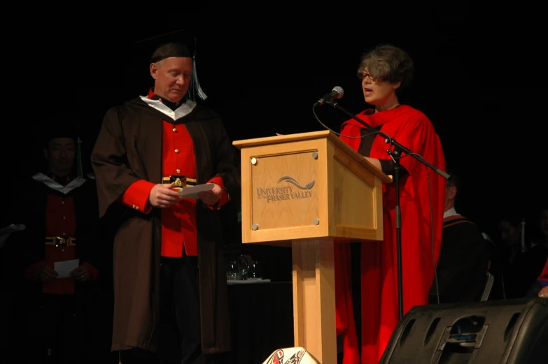 a man and woman standing at a podium