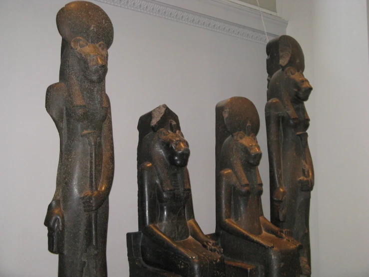 a group of wooden statues next to each other