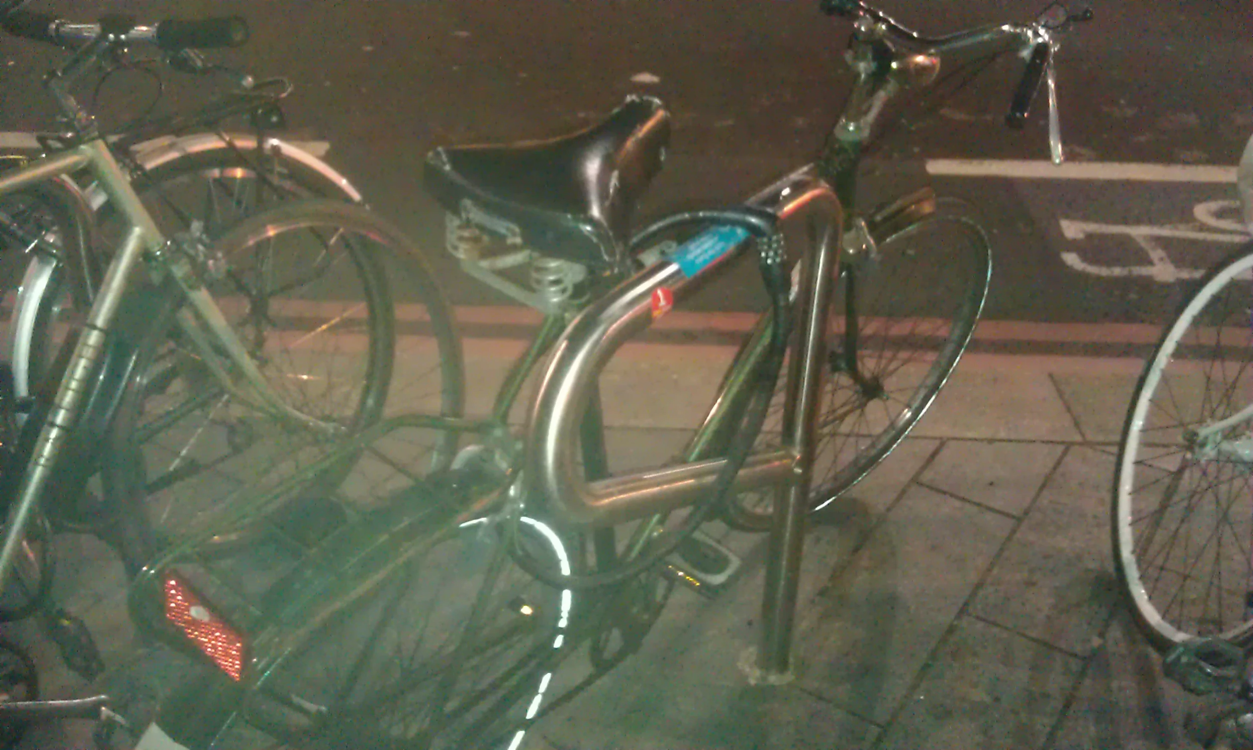 a couple of bikes that are on a sidewalk