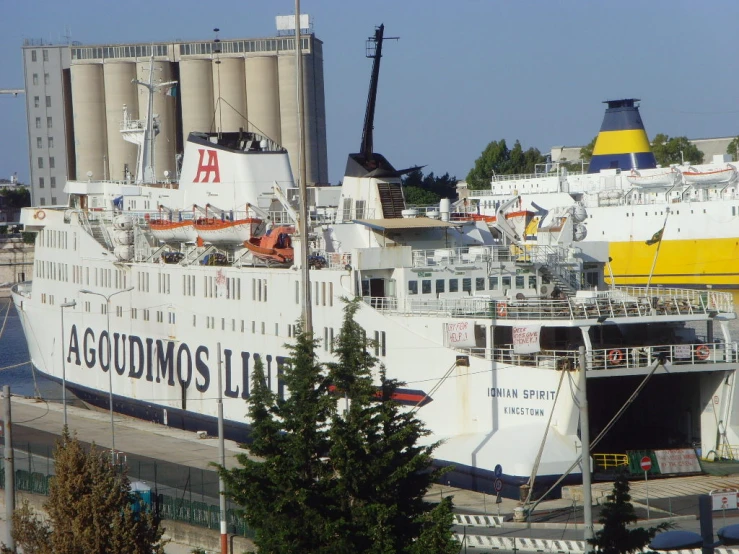 there are two large boats that are docked at the docks