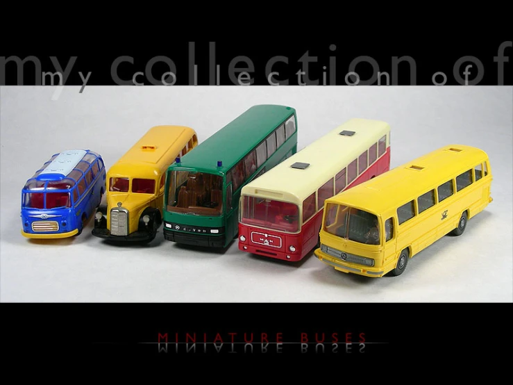 many model buses in a row with the words miniatures buses