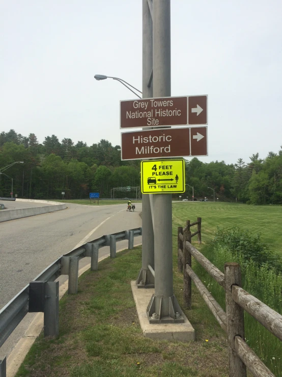 a street pole has directional signs on it