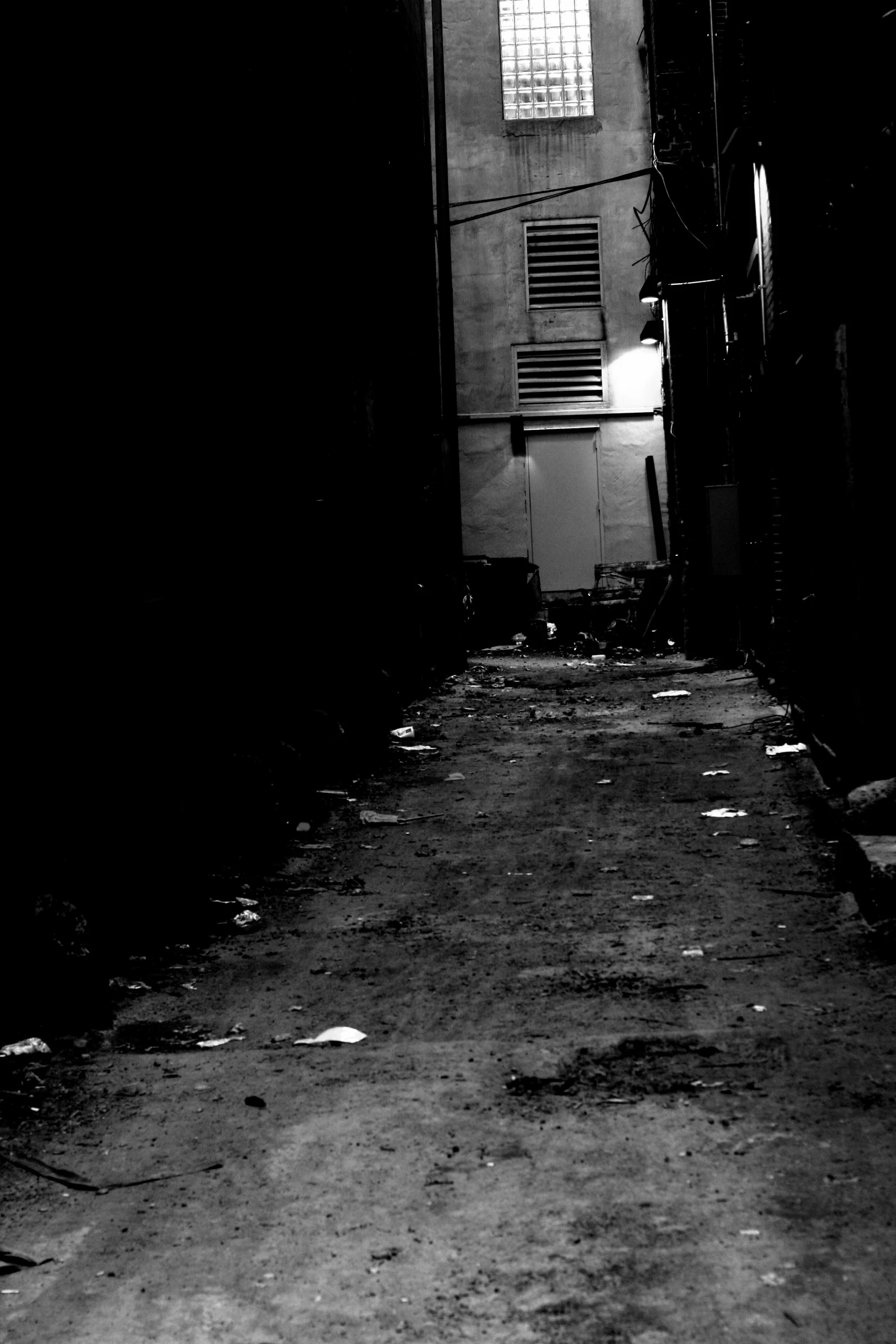 black and white po of a dark alley way