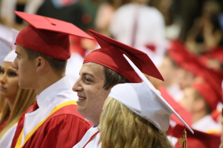 a group of graduates standing next to each other