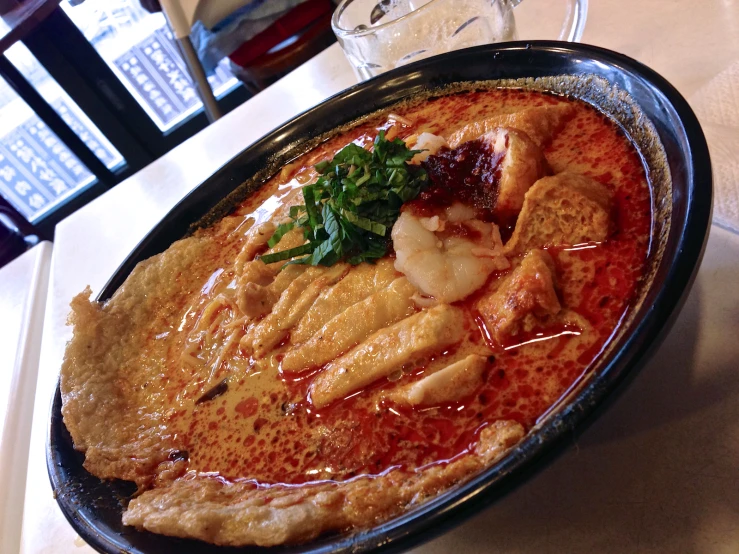 a plate with several meats and sauce on it