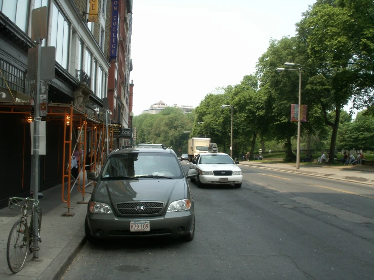 two cars are parked on the side of the street