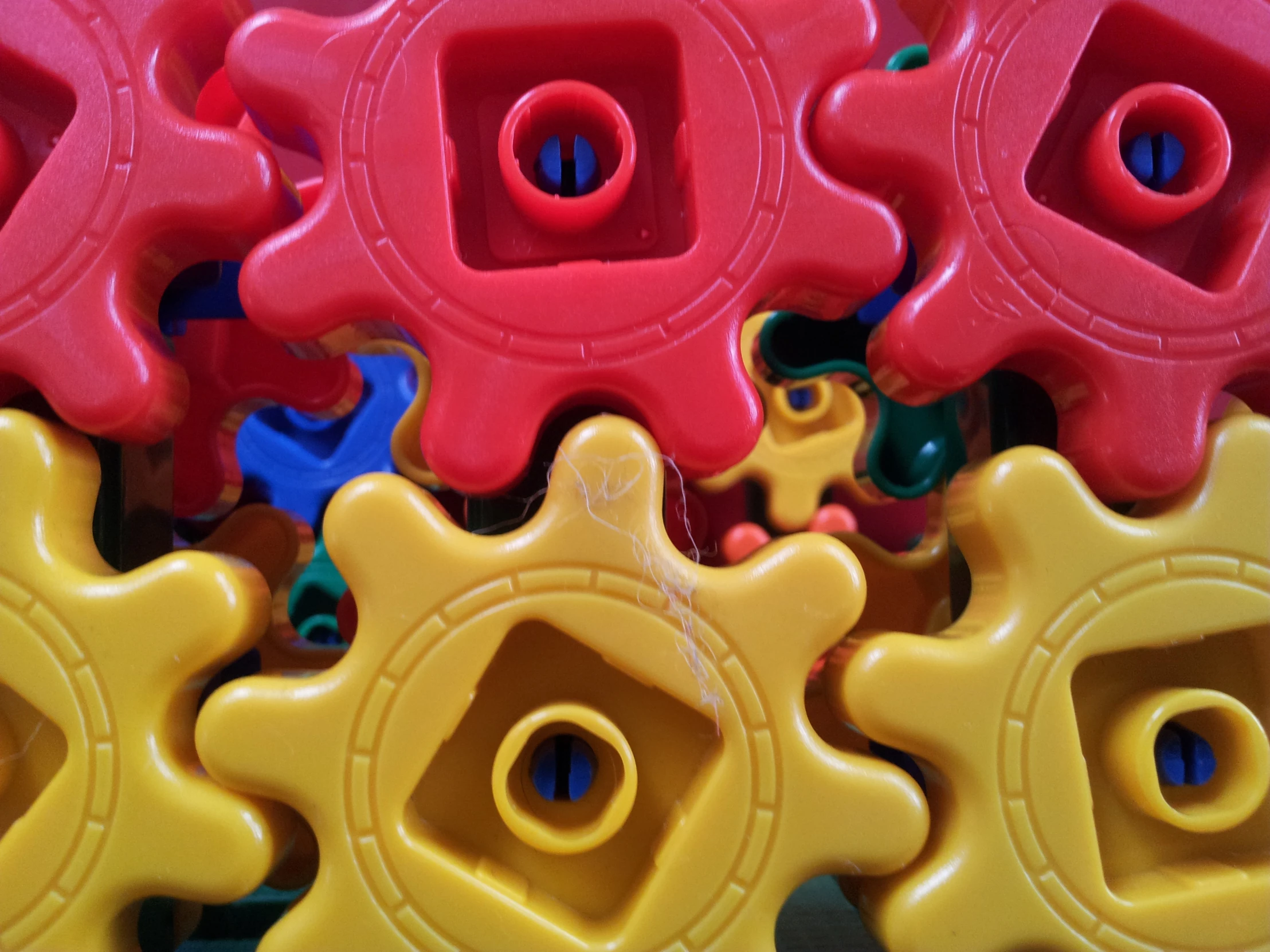 many different colored gears are shown together