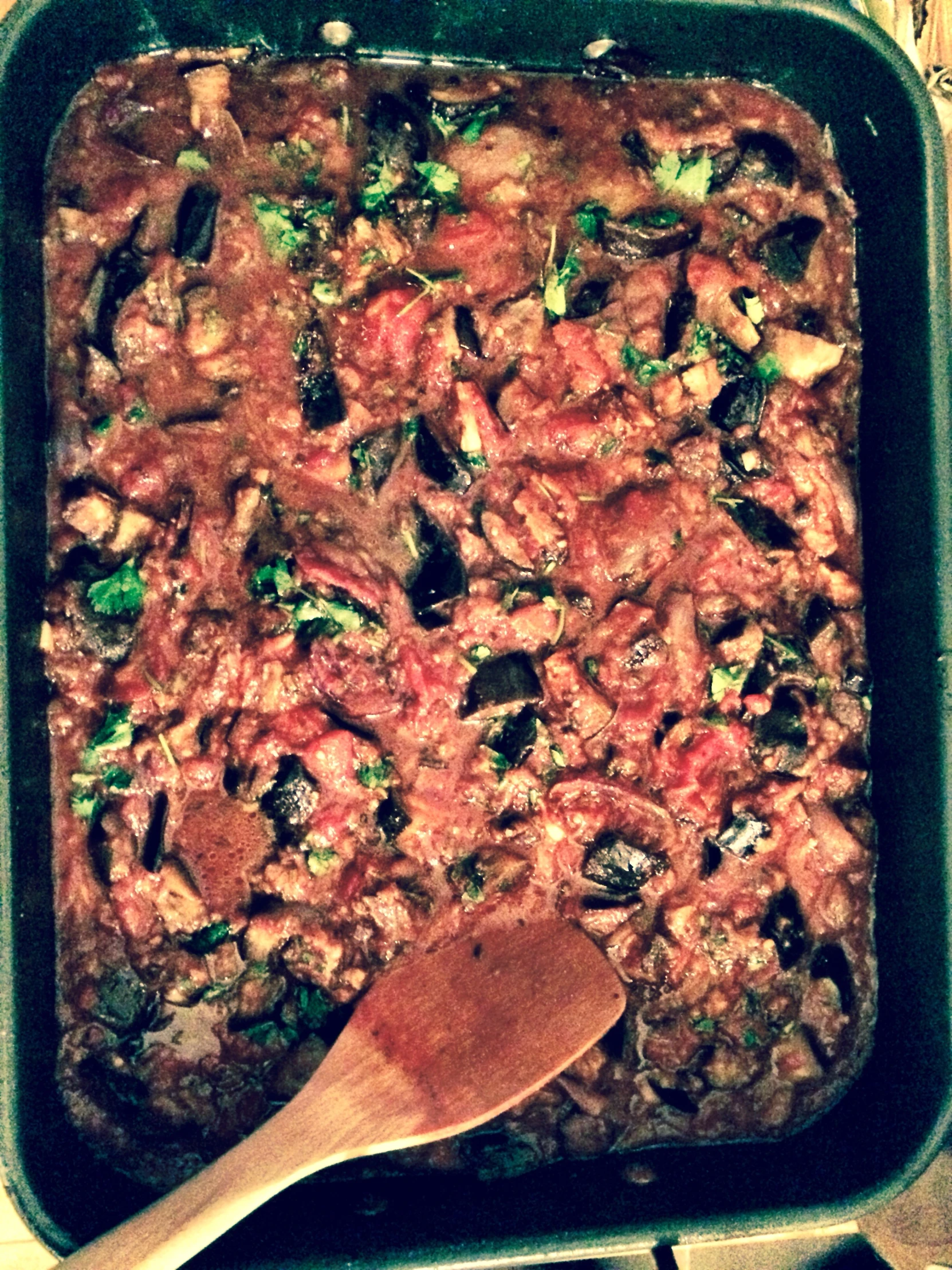 a casserole dish with mushrooms and meat