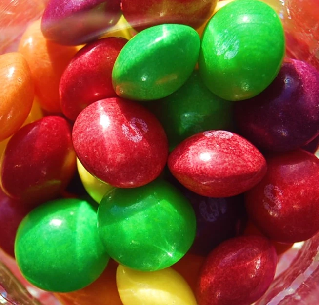 a bowl filled with lots of different colored candies