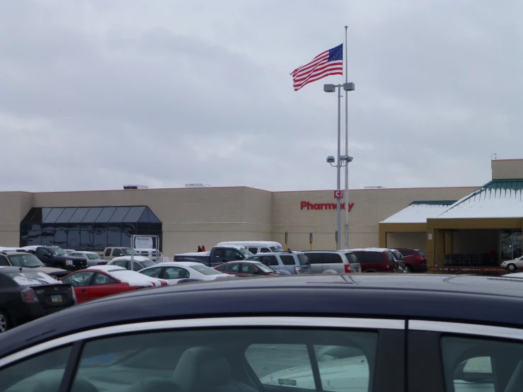 a parking lot full of cars parked on the side of the street