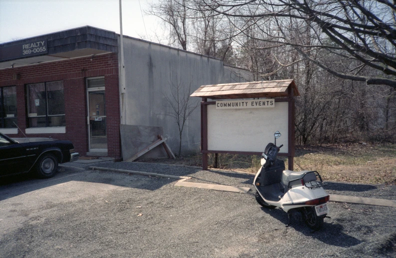 a motor scooter parked in front of an old building