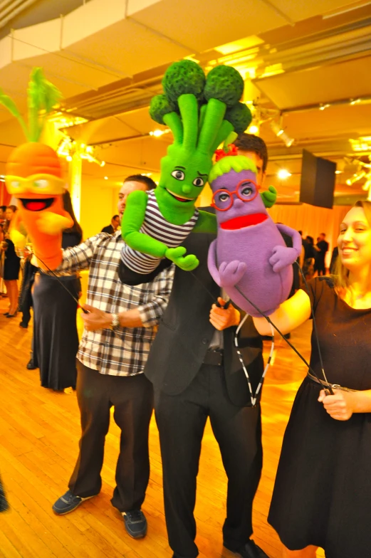 two people are dressed in costumes as green giant heads